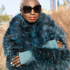 Bianca fingerless teal gloves with alligator-embossed suede back, tonal teal leather palm, silk lining, and open fingertips, back-of-hand view
