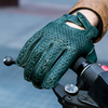 Amalfi Homme hunter green woven lambskin driving gloves with hand-braided palm, perforated fingers, and snap-strap cuff, back-of-hand view