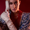 Bianca fingerless stone gloves with alligator-embossed suede back, tonal stone leather palm, silk lining, and open fingertips, back-of-hand view