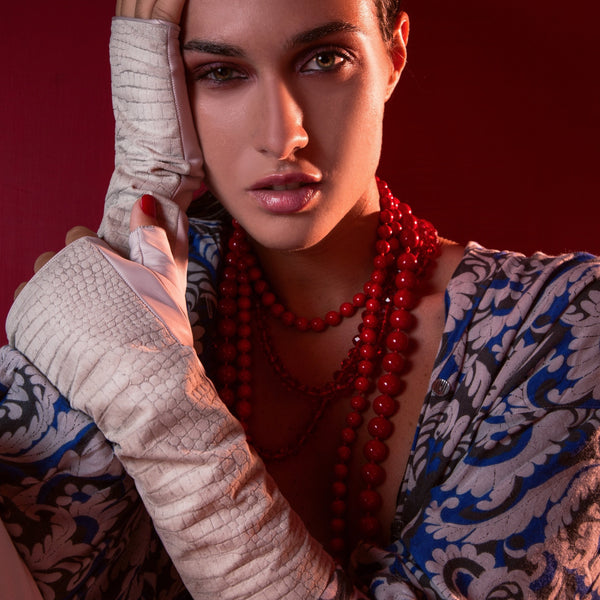 Bianca fingerless stone gloves with alligator-embossed suede back, tonal stone leather palm, silk lining, and open fingertips, back-of-hand view