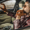 Amalfi Homme cognac woven lambskin driving gloves with hand-braided palm, perforated fingers, and snap-strap cuff, back-of-hand view