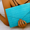 Vesper turquoise basketweave-embossed leather envelope clutch, front view