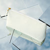Vesper white snakeskin-embossed (cobra) leather makeup case, front view